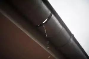 water dripping from cracked gutter
