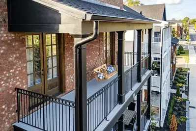new black gutter on multi-story home