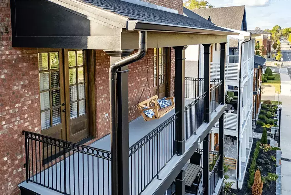 new black gutter on multi-story home