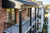 new black gutter on multi-story home