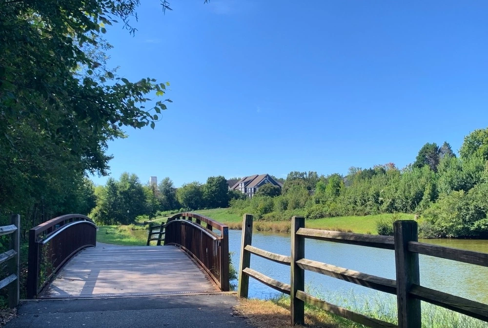 footbridge over lake in Huntersville NC on summer day