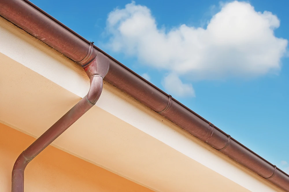 copper gutter against blue sky