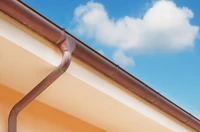 copper gutter against blue sky