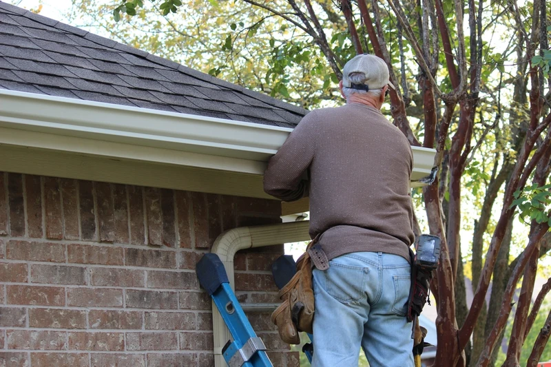 man doing gutter replacement