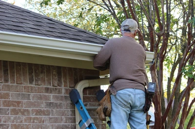 man doing gutter replacement