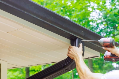 man doing gutter repair